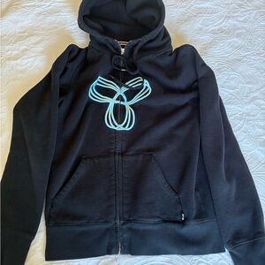 TNA Black Zip-Up Hoodie with Light Blue Emblem
